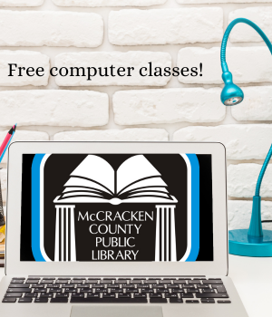 desk with laptop showing library logo.  "free computer classes!"